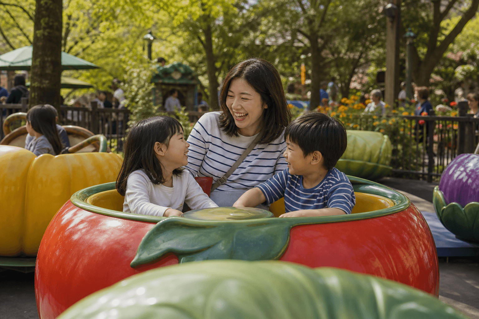 A parent and children laughing together on a colorful garden ride